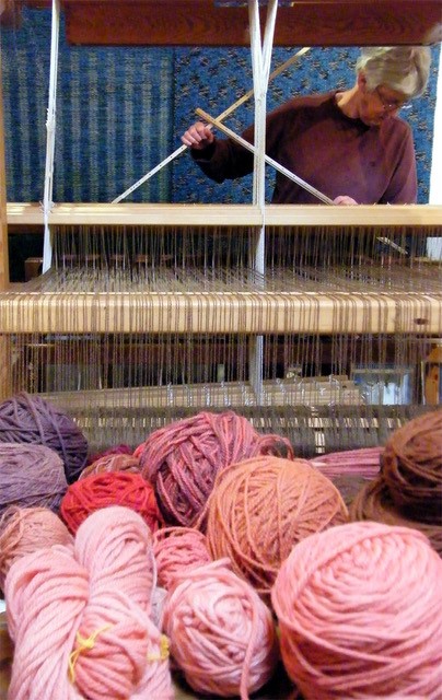 Jenny Wilkson with loom and balls of wool